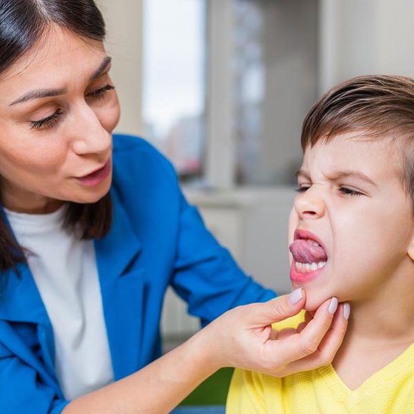 A beautiful woman speech therapist deals with the boy and teaches him the correct pronunciation and competent speech.